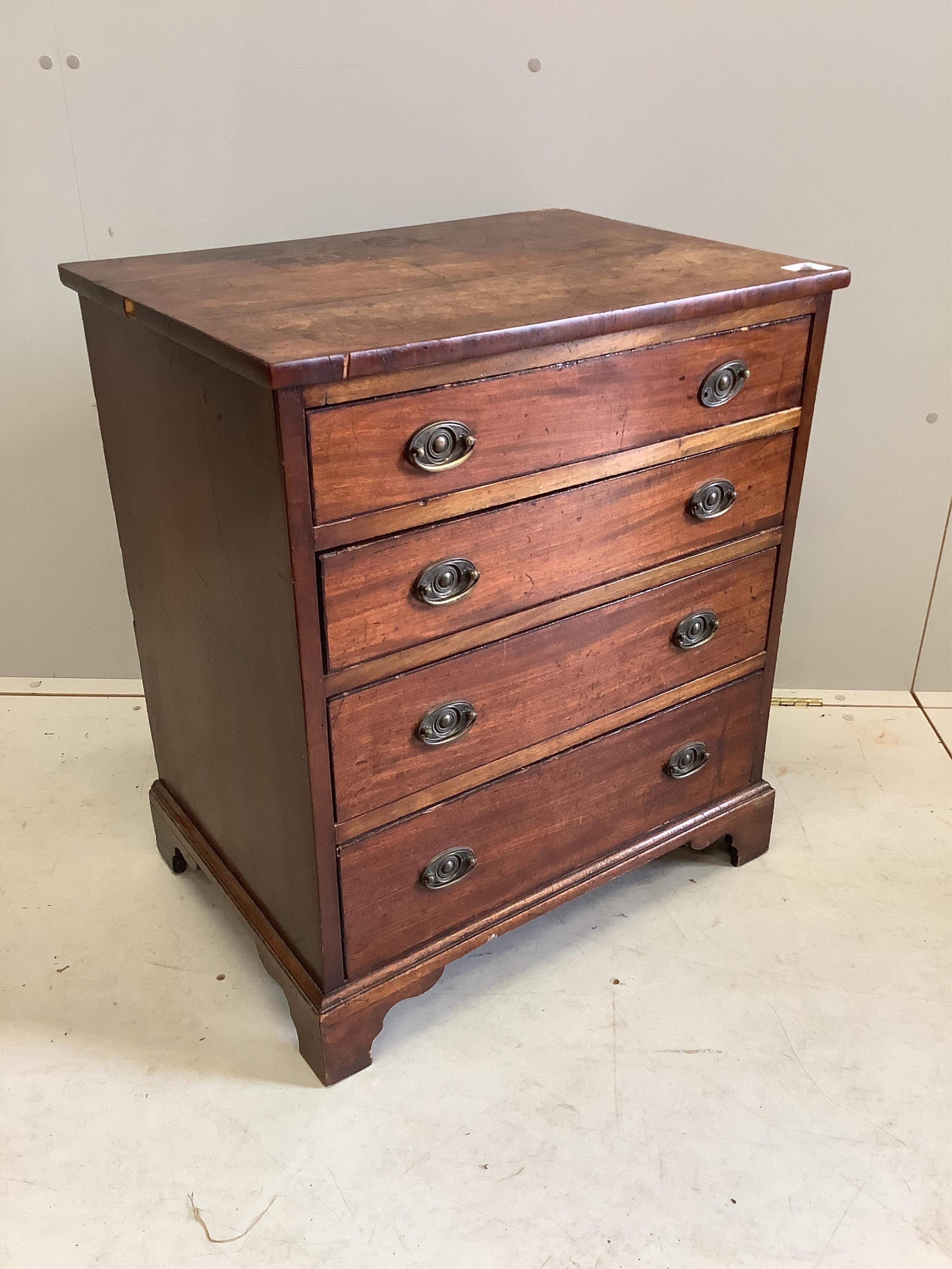 A small 19th century mahogany chest of four graduating drawers raised on bracket supports with brass loop handles, width 53cm, depth 46cm, height 73cm. Condition - poor